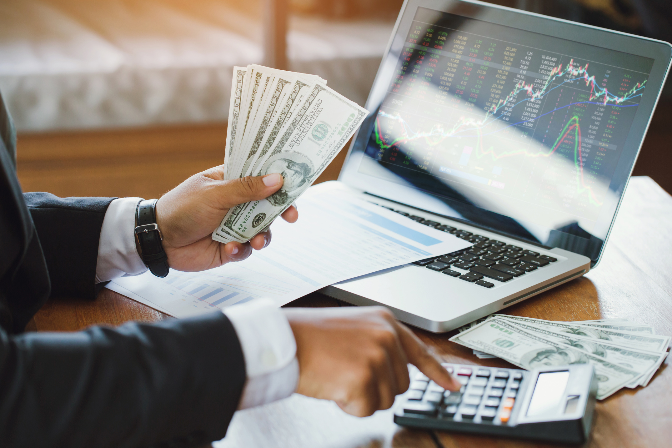 Businessman Calculating Stocks Investment